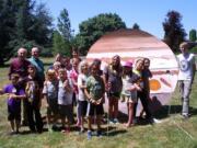 Central Park: Middle School students in Clark College?s Economic and Community Development's Science, Technology, Engineering and Math Camp with model planets they lined up all around campus.