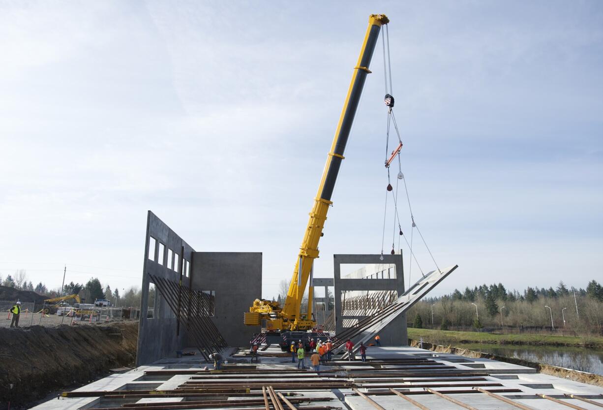 A 600-ton hydraulic crane makes for light work lifting large tilt-up concrete walls at the Dwyer Creek Business Center in Camas on Tuesday.