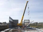 A 600-ton hydraulic crane makes for light work lifting large tilt-up concrete walls at the Dwyer Creek Business Center in Camas on Tuesday.