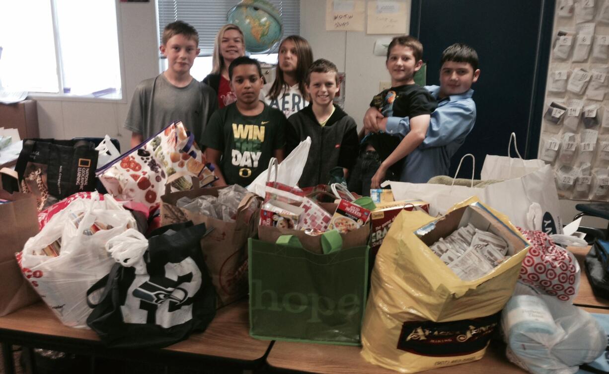 Orchards: Frontier Middle School students stand with donations they helped gather for the Share House during the first Orio Palmer Share House Donation Drive, named after the New York City Fire Department Battalion Chief who died in the 9/11 terrorist attack.