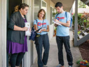 Vancouver Fire Department
Vancouver Fire Corps volunteers Nina and Ryan Cavola speak with a Cascade Park neighborhood resident about preventing home fires.