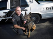 Washougal police Officer Kyle Day poses for a portrait with his K-9 partner, Ranger, on July 8.