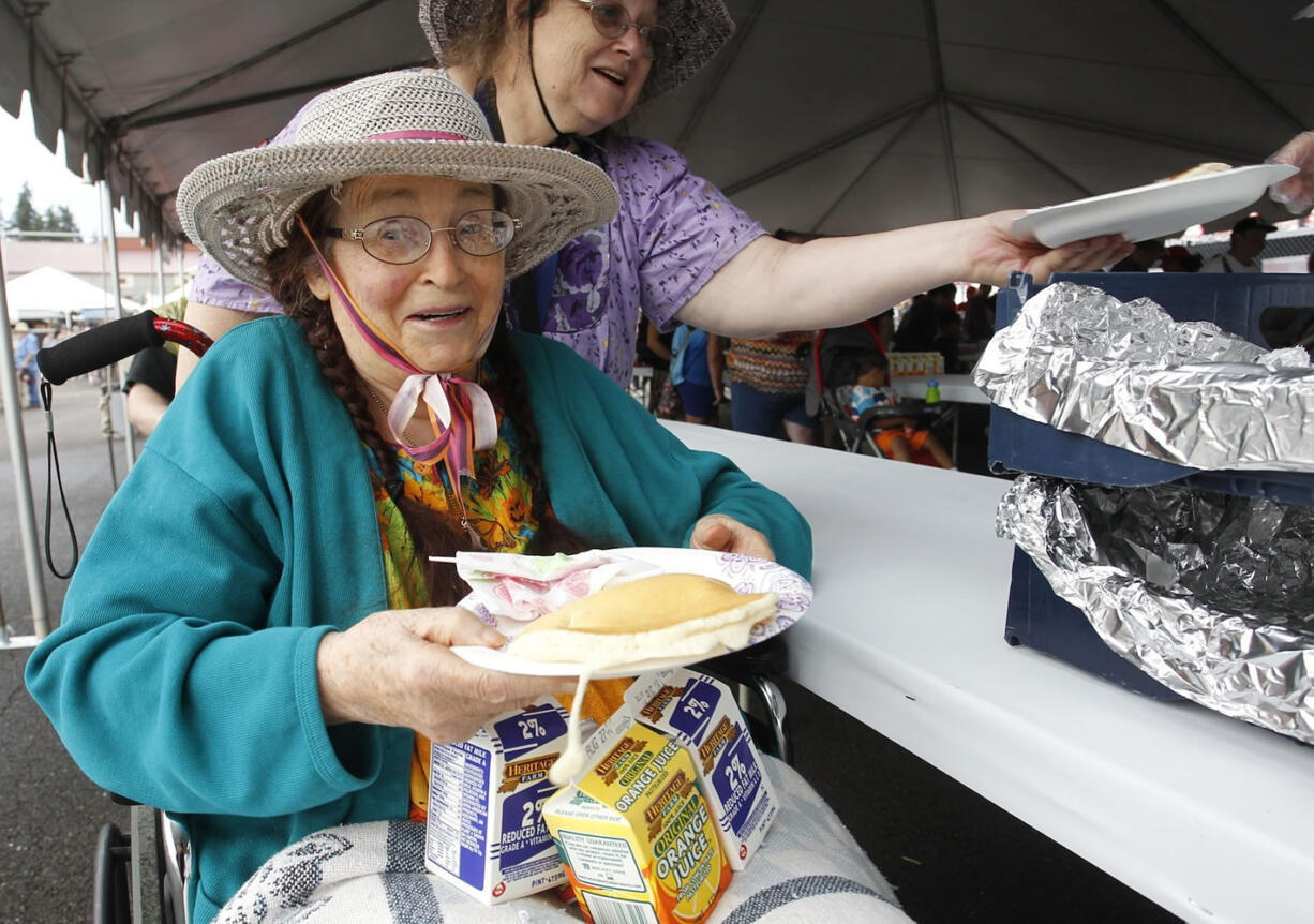 84 year old Dorris Cotten of Vancouver was at the front of the line for pancakes on first day of Clark County fair.