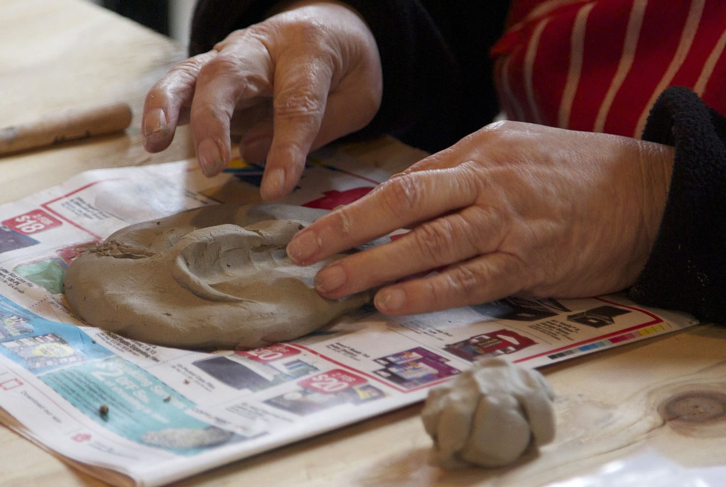 Lillian Pitt forms the structure of a mask at a workshop in Vancouver.