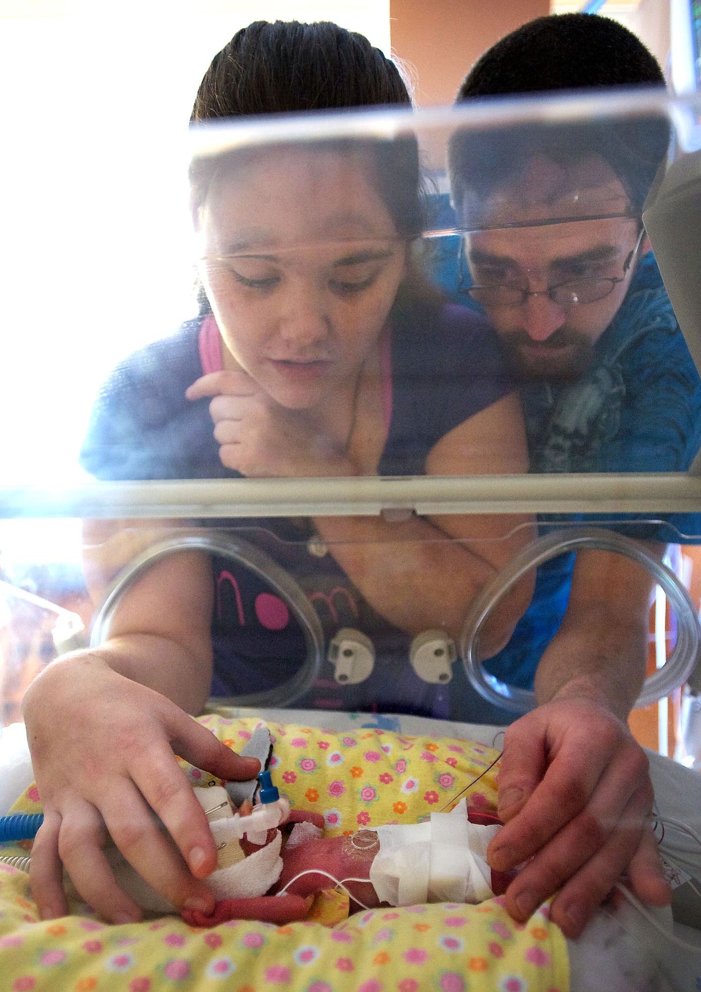 Tiffany Burril, 22, and Mitchall Gulliksen, 22, both of Vancouver, visit with their newborn baby girl Harley Gulliksen, whose birth weight was a mere 15-ounces at Legacy Salmon Creek Medical Center on Monday December 24, 2012.