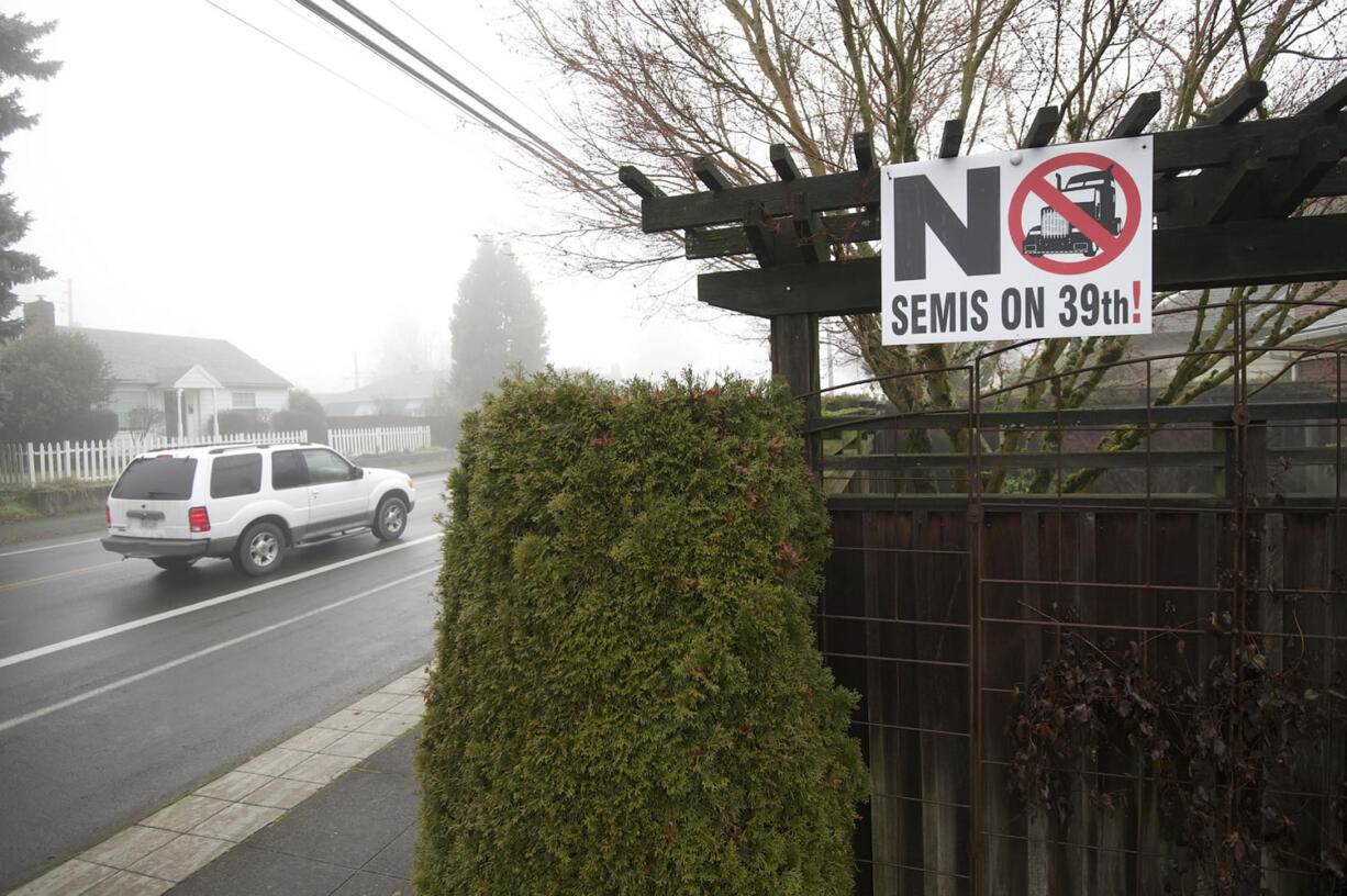 Signs such as this one, as seen in December 2013, had already been posted for more than a year by residents who wanted the city of Vancouver to ban tractor-trailers from West 39th Street. Trucks use the street to get from Interstate 5 to Fruit Valley Road and the Port of Vancouver. The city, working on a Westside Mobility Strategy to find a balance between neighborhood liveability and economic growth, plans a community forum on the topic from 9 a.m. to noon Saturday at Discovery Middle School, 800 E.