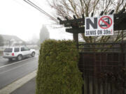 Signs such as this one, as seen in December 2013, had already been posted for more than a year by residents who wanted the city of Vancouver to ban tractor-trailers from West 39th Street. Trucks use the street to get from Interstate 5 to Fruit Valley Road and the Port of Vancouver. The city, working on a Westside Mobility Strategy to find a balance between neighborhood liveability and economic growth, plans a community forum on the topic from 9 a.m. to noon Saturday at Discovery Middle School, 800 E.