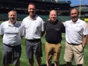 East Vancouver: Brian Apling, black shirt, joined trainers from the Seattle Mariners at Safeco Field on July 28 to talk to children as part of Professional Baseball Athletic Trainers Society's PLAY Campaign.