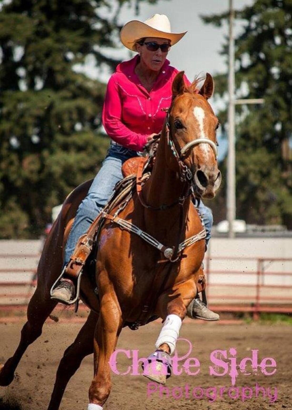 Orchards: Tina Olson, founder of The Chopper Fund, and her horse Dash at the Chasin' For Chopper barrel racing event to raise money for major medical expenses for shelter animals.