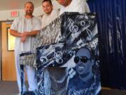 Larch Corrections Center art club members Melville Tangen, Bryan McGee and Antonio Ruiz painted this conspicuously cosmic piano.