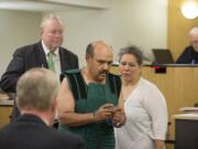 Samuel U. Morales of Woodland, center, makes a first appearance Friday in Clark County Superior Court after allegedly setting fires along Interstate 5 south of Ridgefield on Wednesday.