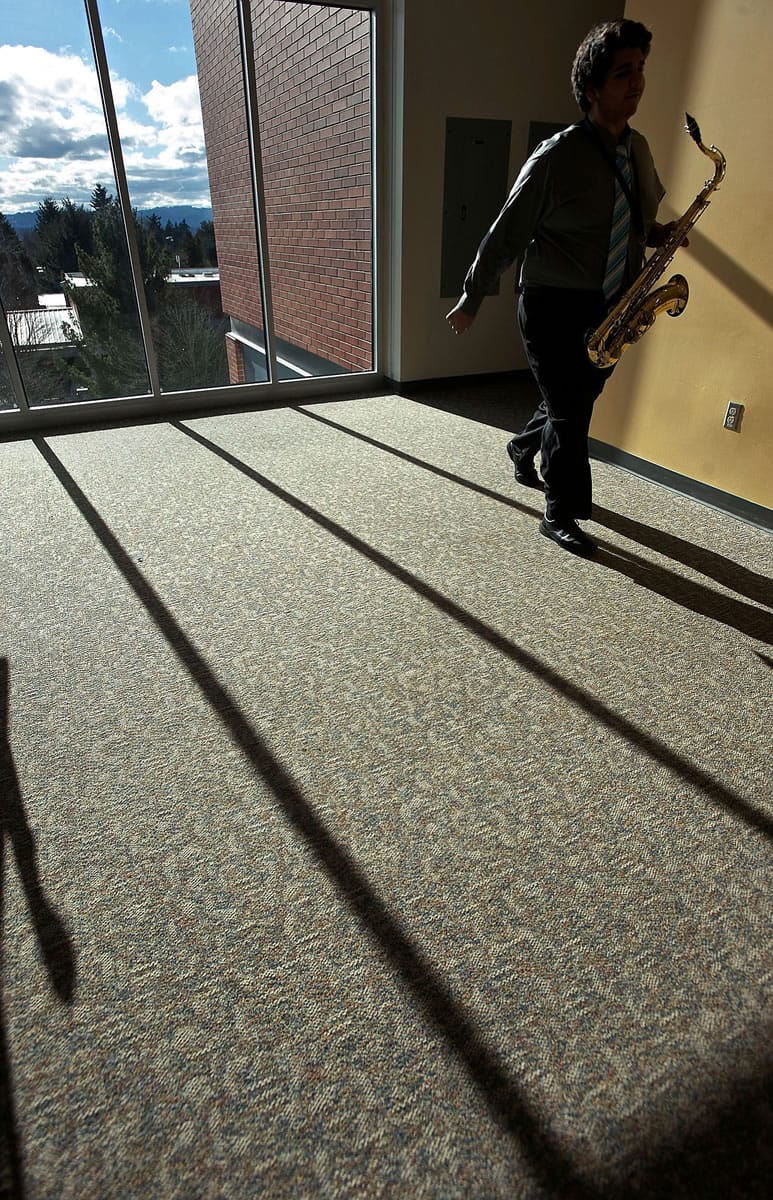 West Salem saxophonist Shayan Tahmaseb, 16, walks out of a practice room during the 52nd Annual Clark College Jazz Festival on Saturday February 1, 2014.