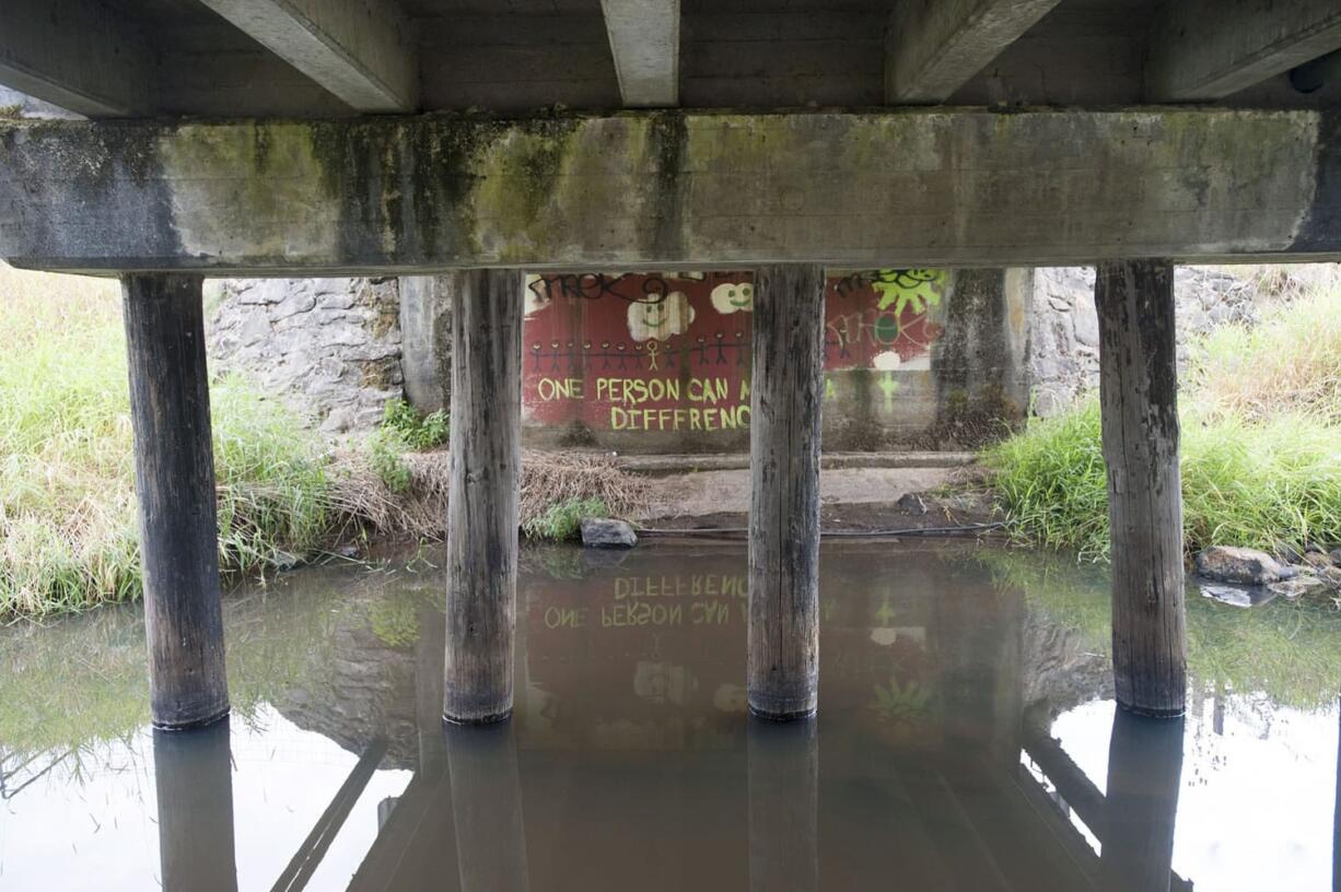 The Fifth Plain Creek Bridge along Northeast 88th Street sits on wooden pilings and is the last Clark County-owned bridge with wood supports.