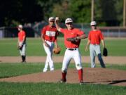 Hazel Dell Metro's Jasper Rank, center, and teammates practice at Columbia River High's field in preparation for the Babe Ruth World Series.