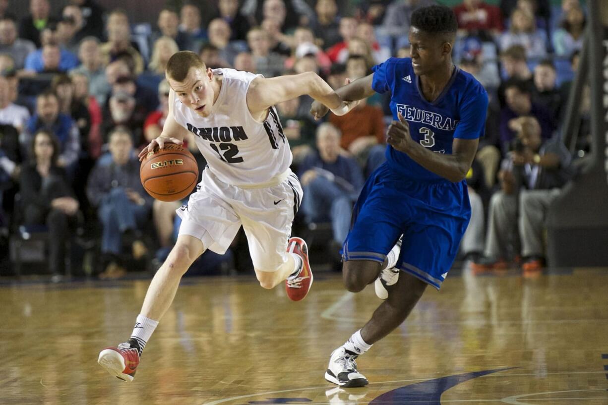 Micah Paulson drives on a defender in Union's loss to Federal Way