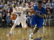 Micah Paulson drives on a defender in Union's loss to Federal Way