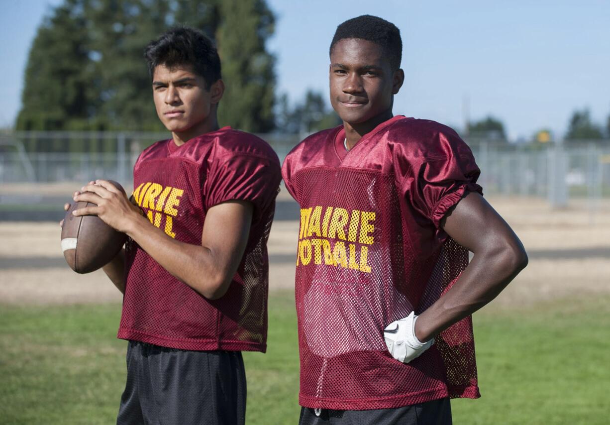 Prairie juniors quarterback Kevin Aguirre, left, and defensive back Jaelen Stephen learned a lot from playing on varsity as sophomores.