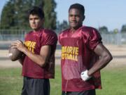 Prairie juniors quarterback Kevin Aguirre, left, and defensive back Jaelen Stephen learned a lot from playing on varsity as sophomores.