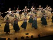 Wahine dancers from the Kaleinani o ke Kukui dance school perform during the Ke Kukui Foundation's Cultural Lu'au at Thomas Jefferson Middle School on Saturday.