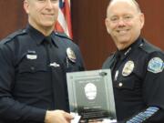 Battle Ground: Battle Ground Detective Philip Anderson, left, and Police Chief Bob Richardson at the March 16 city council meeting, where Anderson was named Officer of the Year.