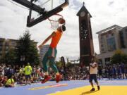 Tanner Fogle elevates in the slam dunk contest at Hoops on the River Saturday in Esther Short Park in downtown Vancouver.