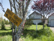 Police say squatters who live in a rural Washougal house took down and sold the white fencing that surrounded the house.