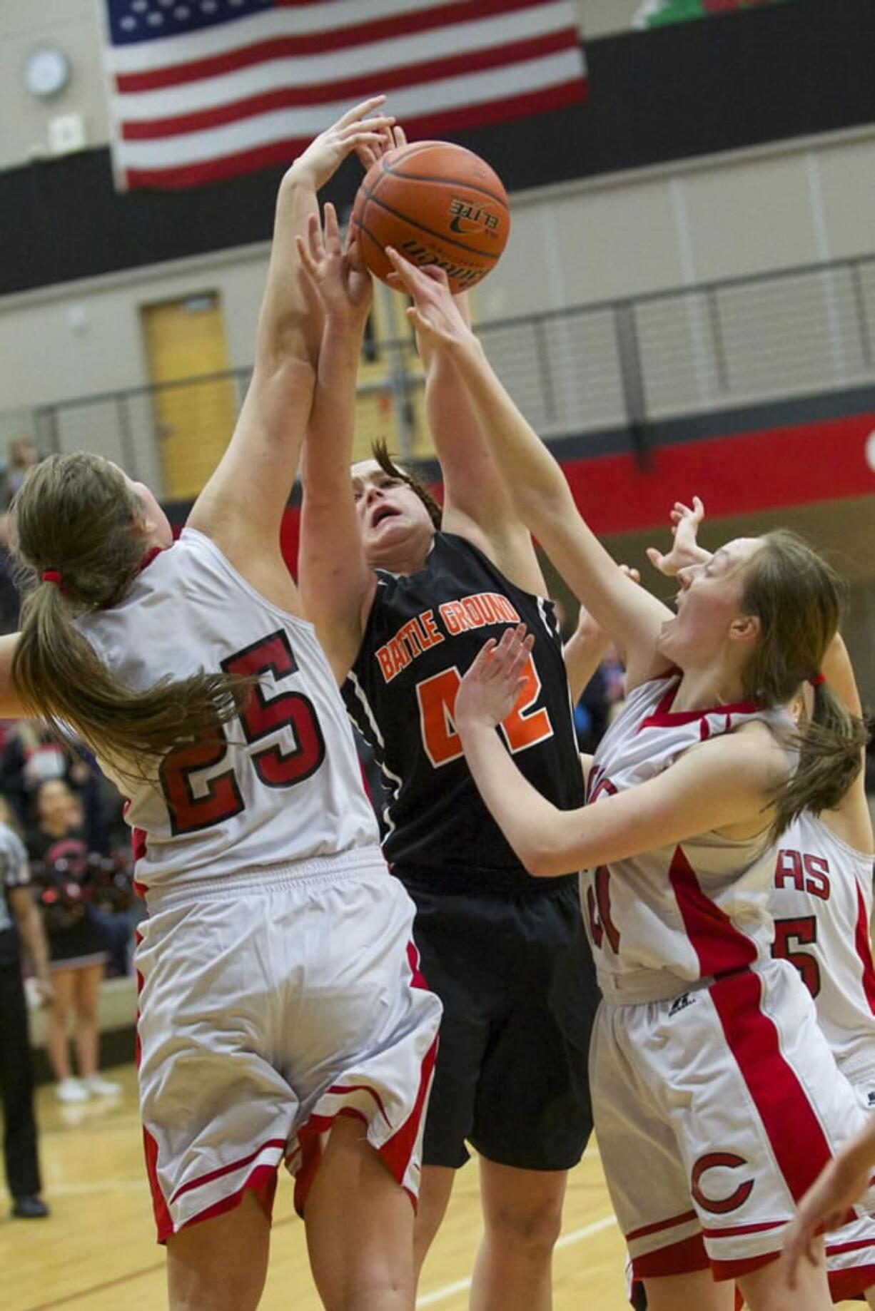 Camas defenders Nikki Corbett (25) and Emma Jones (21) block a potential game-tying shot by Battle Ground's Jossilyn Blackman (42) in the last seconds of Friday's game.