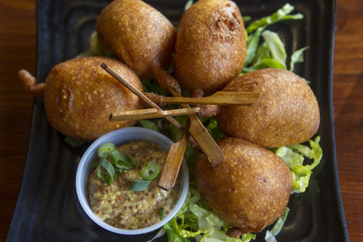 Sausage poppers are served Jan. 21 at Frontier Public House in Vancouver.