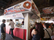 The DeMolay concessions stand at the Clark County Fair sells onion blossoms and other food Sunday.