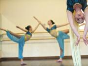 Aerial silks soloist Kady Lawson, 17, and Arabian dancers Sydney Reed, 14, background right, and Madison Reznicki, 11, practice &quot;The Nutcracker&quot; at DanceWorks Studio on Nov. 17. DanceWorks and Vancouver City Ballet present &quot;The Nutcracker&quot; Dec.