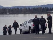 A woman was treated at the scene after she apparently intentionally drove her car into the Columbia River this afternoon at the Marine Park boat launch in Vancouver.