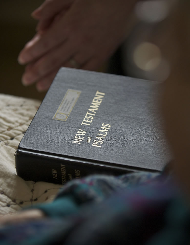 A bible sits on 86-year-old patient Phyllis White's bed at the Ray Hickey Hospice House on Thursday April 18, 2013.