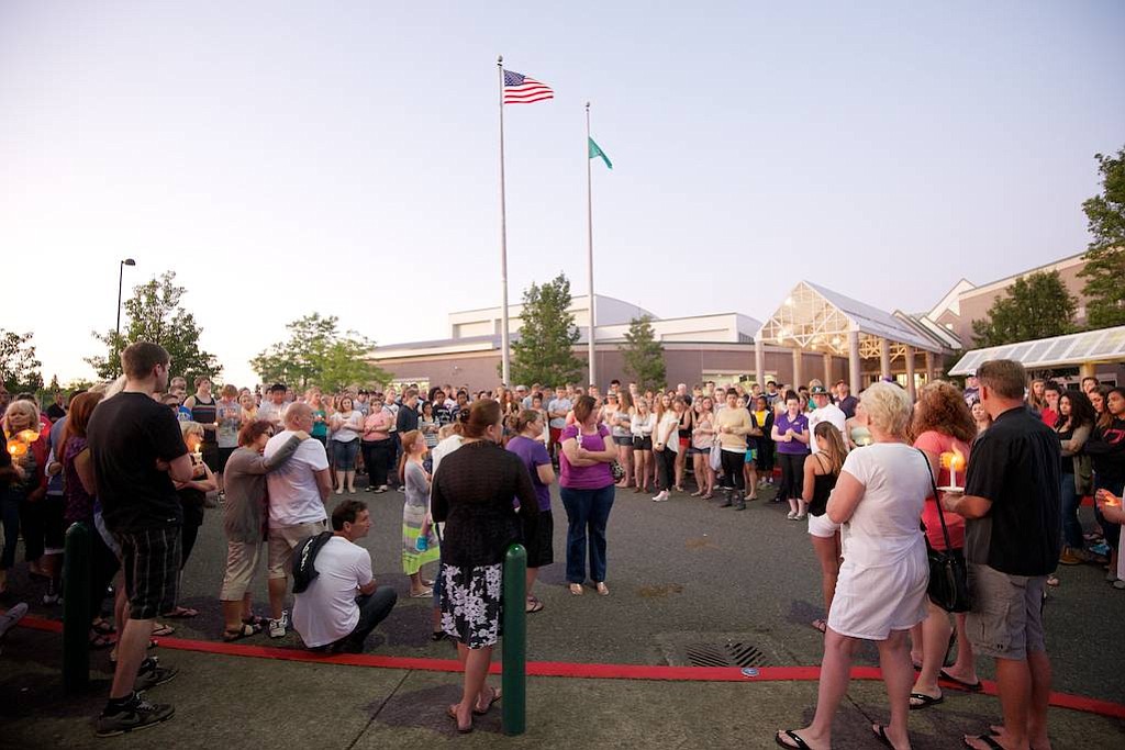 Students from Skyview High School, along with family members and friends, take part in a candle light vigil Tuesday July 2, 2013 in Vancouver, Washington held in honor for classmate Kaitlin Miller, 17, who she died from injuries she sustained in a car accident Monday night.