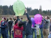 Student Ryan Maloney releases a paper lantern at the Center for Agriculture, Science and Environmental Education on Wednesday.