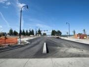 The roads, curbing and utilities in the $1.3 billion Columbia River waterfront redevelopment project are in place, and over the next few weeks, workers will finish installing streetlights and traffic signals, pouring the rest of the sidewalks and planting landscaping.