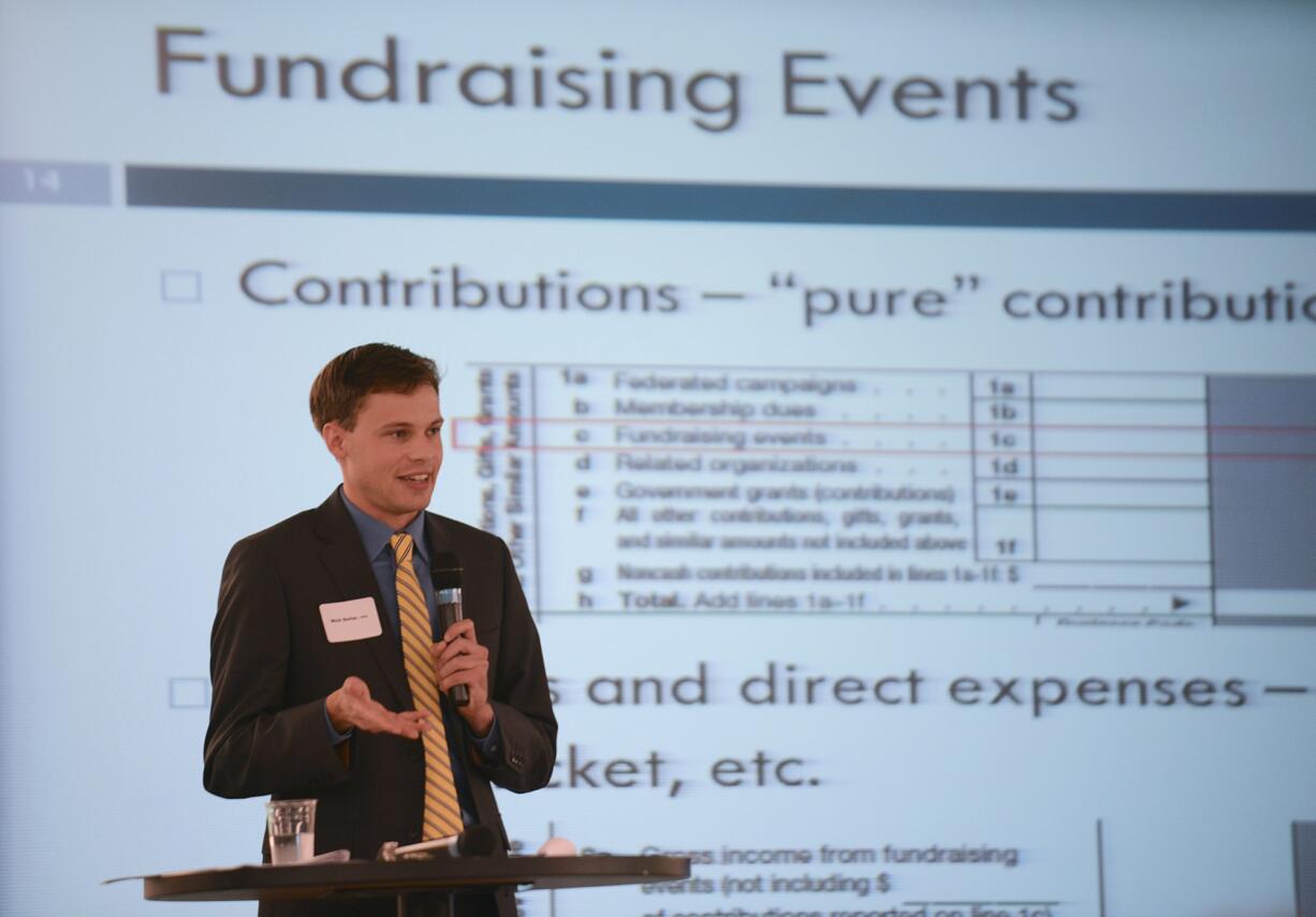 Certified public accountant Nick Dollar speaks to guests at PeaceHealth headquarters about how tax information was gathered for the Nonprofit Revenue Review.