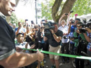 Vancouver Mayor Tim Leavitt cuts the ribbon at Main Street Marijuana on Wednesday.