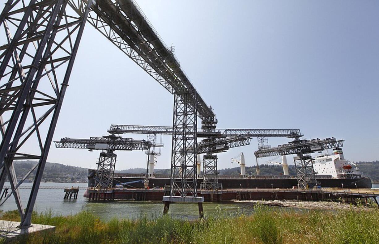 A grain ship loads at the EGT dock at the Port of Longview. When operating at full speed, EGT estimates it will handle 200 ships a year.