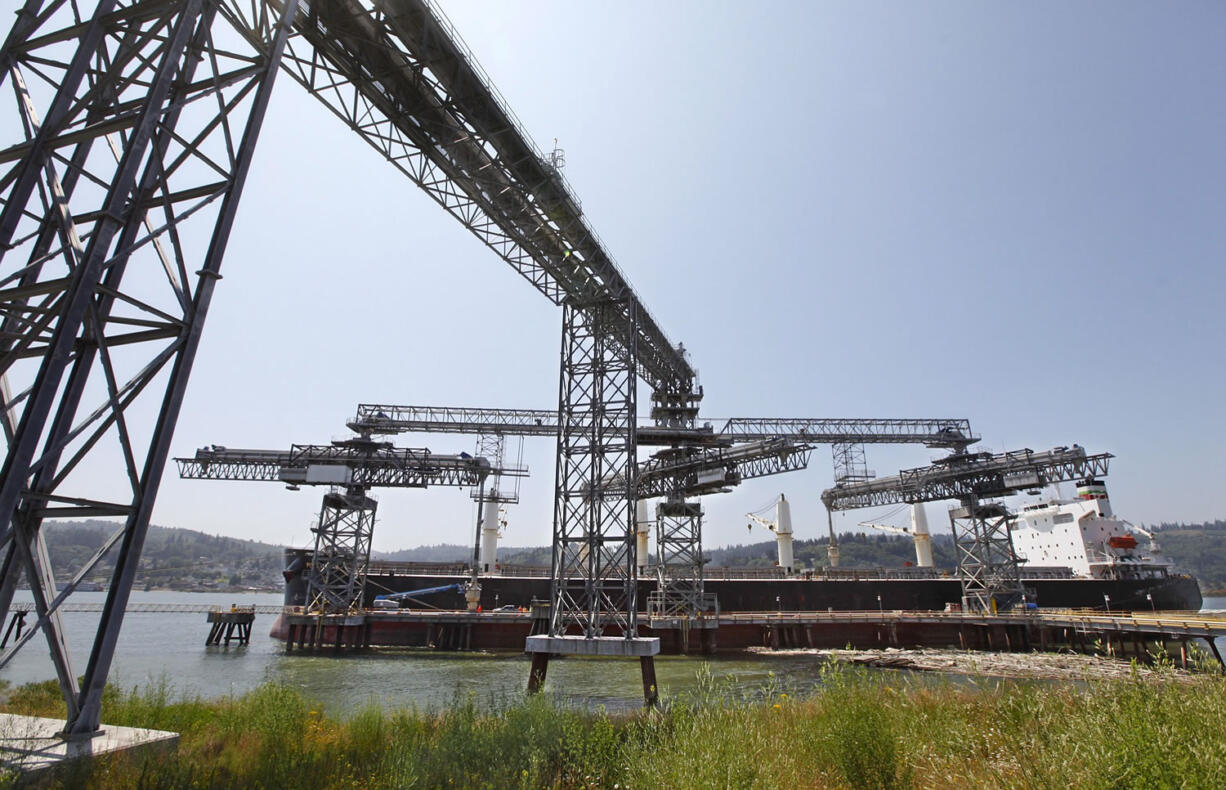 A grain ship loads at the EGT dock at the Port of Longview. The administration of Gov.