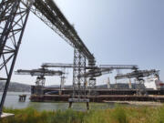 A grain ship loads at the EGT dock at the Port of Longview. The administration of Gov.