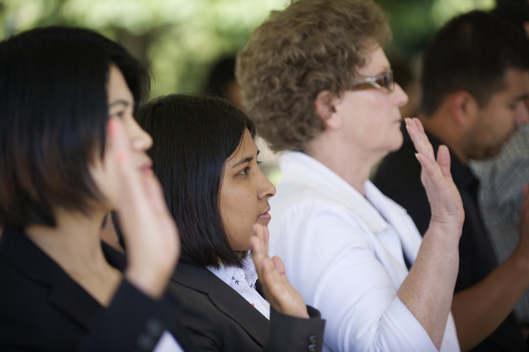 Anita Sarki, center, born in Bhutan and a refugee from Nepal,  becomes a U.S.