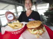 Eating a Jumbo burger, with Steakburger sauce and steak fries at Steakburger on the Go, is more like biting into a steak than most finely ground beef patties.