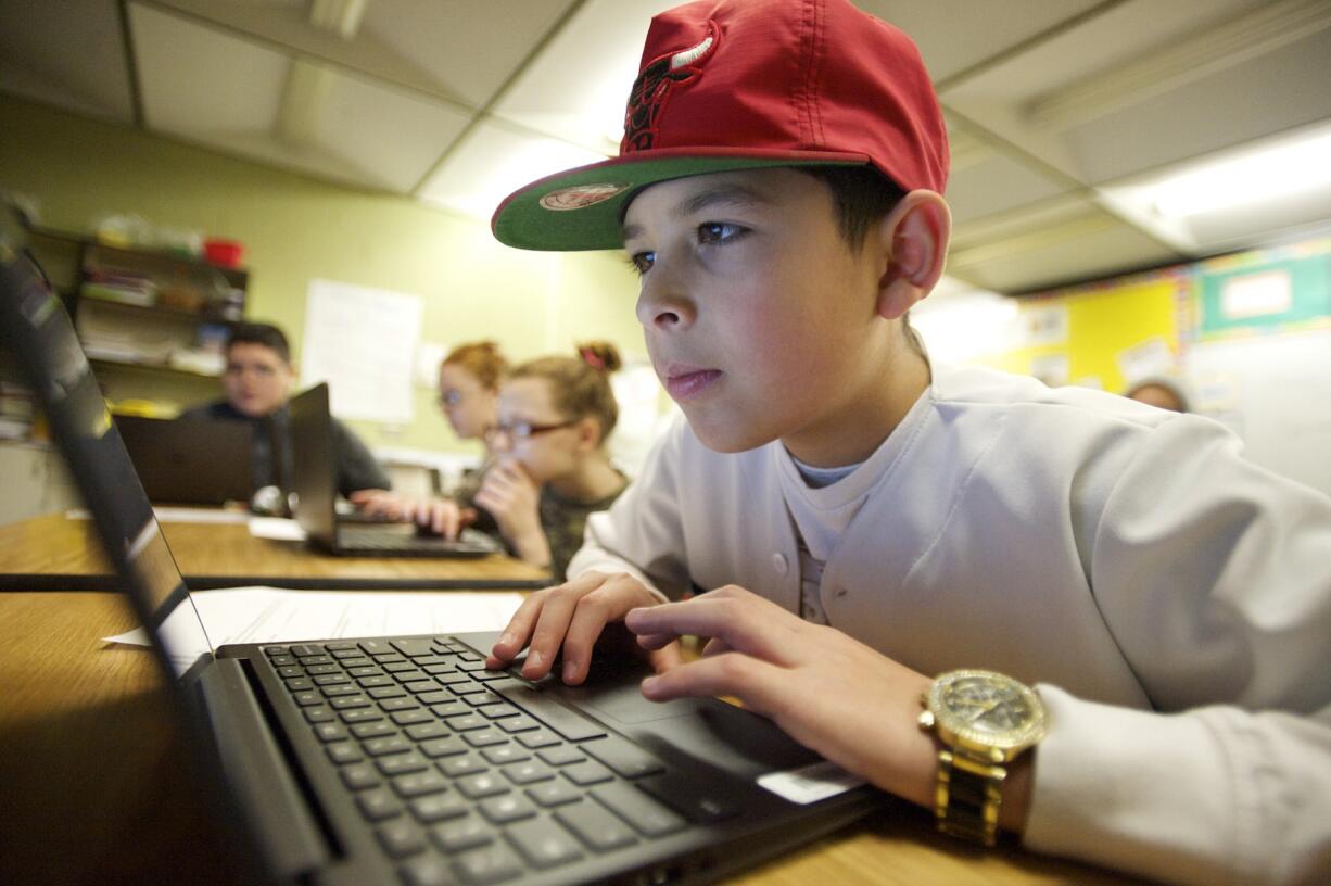 Wy'east Middle School sixth-grader Angel Amador, 12, uses a Chromebook to take a Smarter Balanced math practice test on Monday.