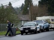 Vancouver Police Officer Ken Suvada follows up on an investigation on Martin Way in the Edgewood Park neighborhood.