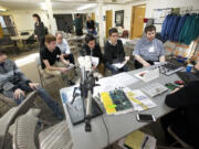 Lisa Paola, a process engineer, talks to students interested in engineering careers at a Business After School event Monday at Silicon Forest Electronics in Vancouver.