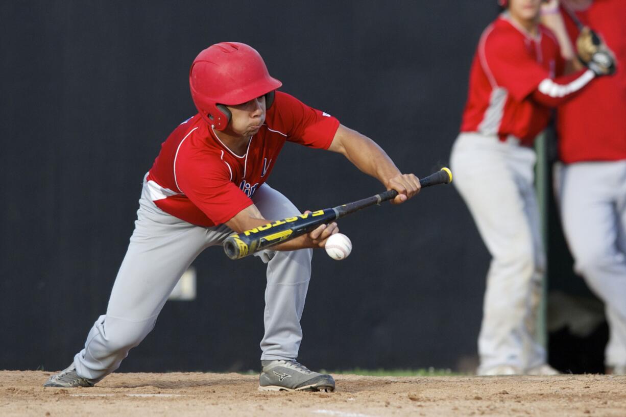 Vancouver Cardinals Ethan Beniga lays down a bunt to advance a baserunner in the first round of the 10th Annual Curt Daniels Invitational Baseball Tournament at Propstra Stadium, Thursday.