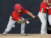 Vancouver Cardinals Ethan Beniga lays down a bunt to advance a baserunner in the first round of the 10th Annual Curt Daniels Invitational Baseball Tournament at Propstra Stadium, Thursday.