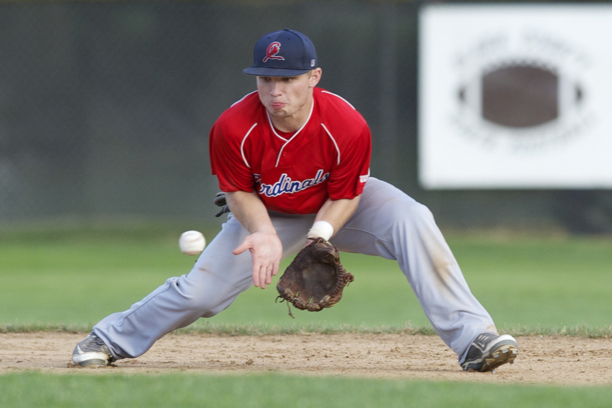 Vancouver Cardinals Jay Becker fields a grounder for an out.