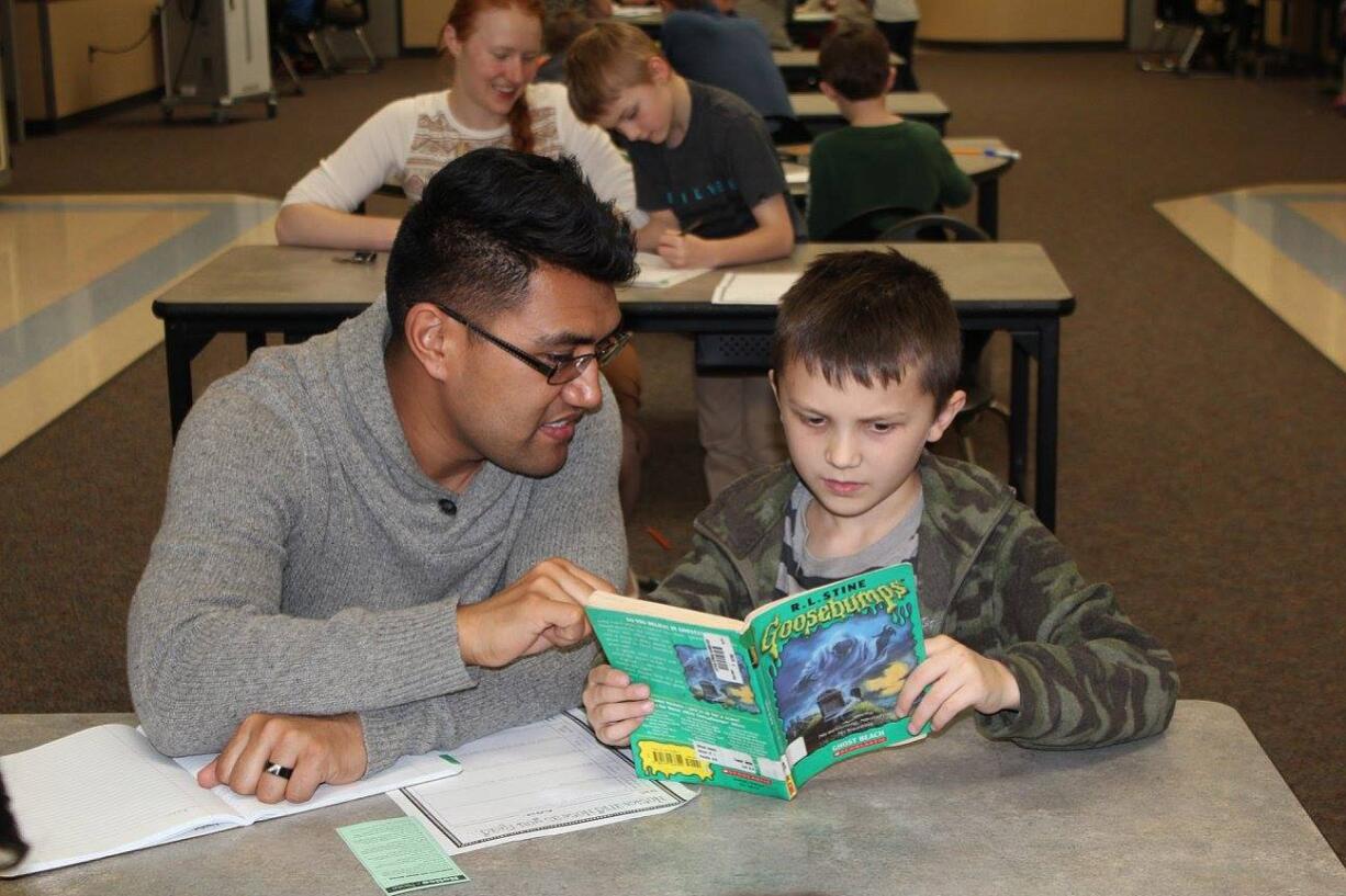 Battle Ground: Elementary education students from Washington State University Vancouver have been helping Milo Levanen, right, and other third-grade students at Captain Strong Primary School with their reading this semester.