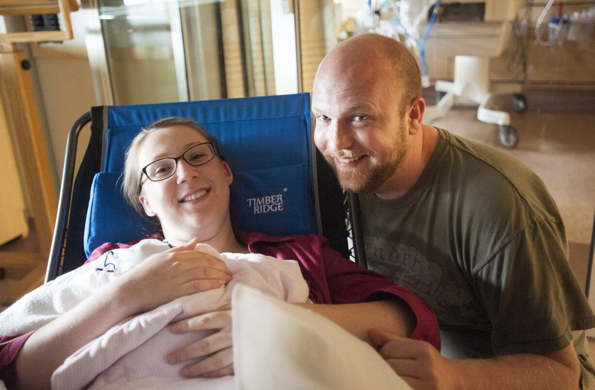 Kadie and David Warner are the new parents of spontaneous triplets born at PeaceHealth Southwest Medical Center.